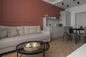 Część dzienna w Apartamencie STUDIO z oddzieloną sypialnią A413 Carmine Red